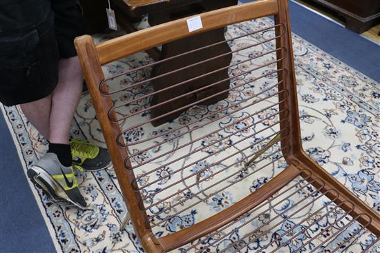 Peter Hvidt & Orla Molgaard Nielsen. A pair of teak and brass Boomerang chairs, 1950s, by France & Sons, W.60cm